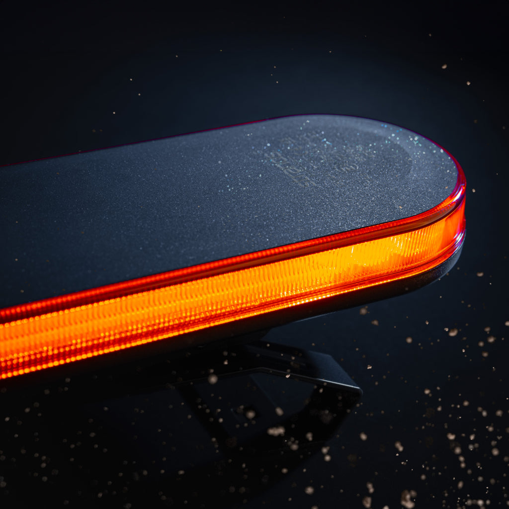Roof-mounted LED light bar and driving lights installed on a work truck for enhanced nighttime visibility and safety