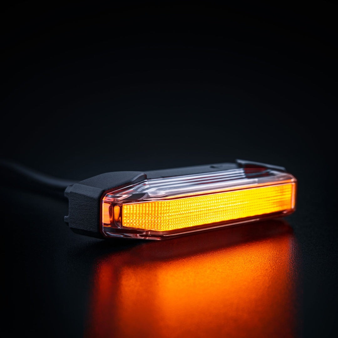 LED driving lights, cube lights, and amber side marker lights professionally installed on a fleet truck for improved year-round nighttime visibility and safety.
