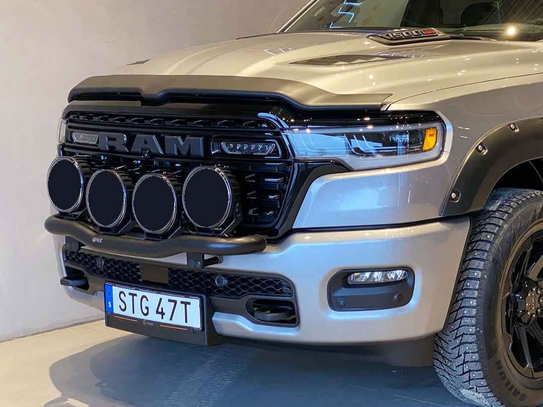 Close-up of Q-LIGHT mounting bar with four spotlight mounts on RAM 1500 DT