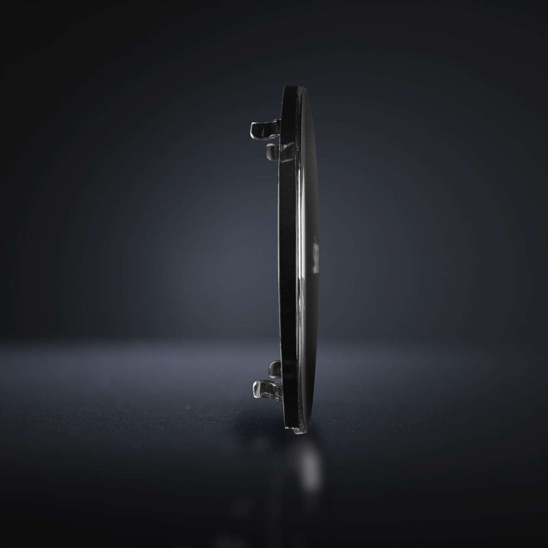 Profile view of the thin dark tinted cover for Siberia driving lights with mounting clips