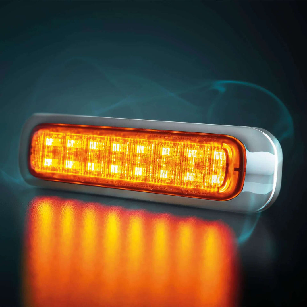 Ultra slim LED side marker with amber light and chrome frame on dark background