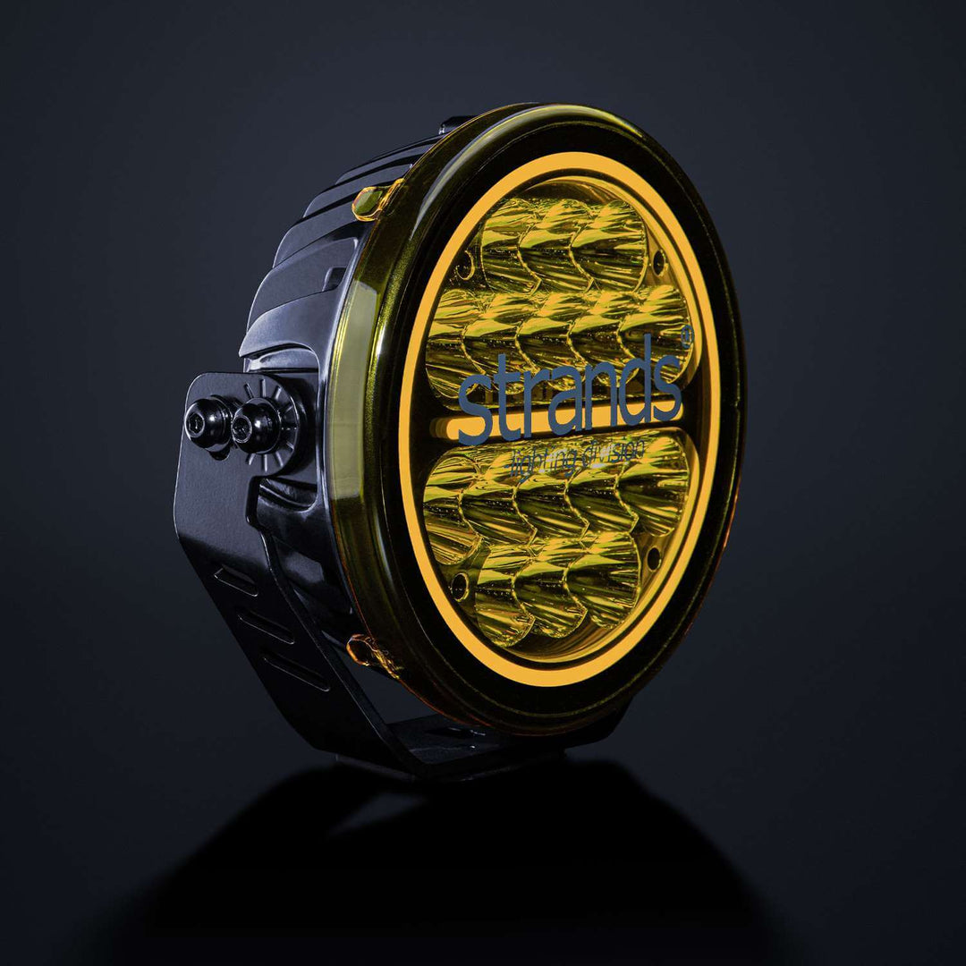 Yellow lens cover installed on Siberia driving light, angled view
